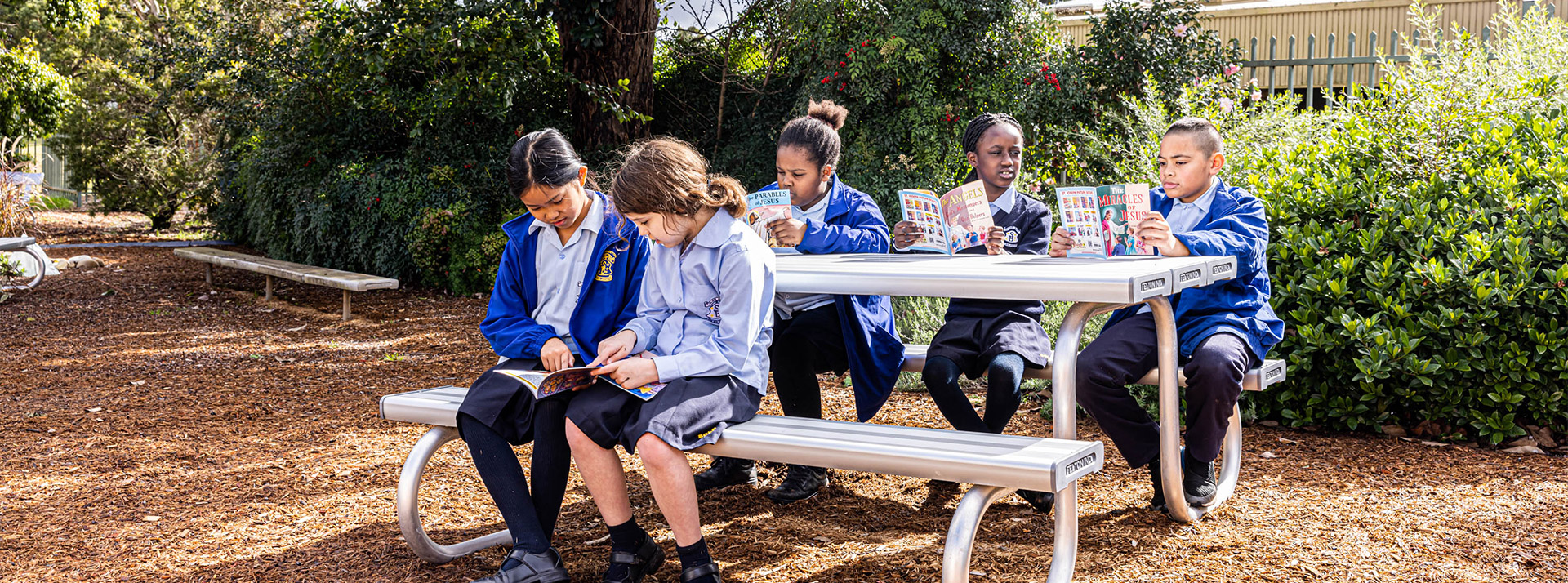 St Bernadette's Catholic Primary School Lalor Park students on park bench