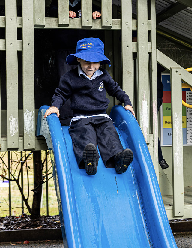 St Bernadette's Catholic Primary School Lalor Park student using slippery dip