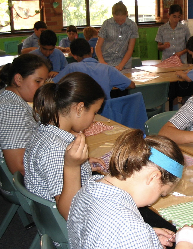 Old photo of St Bernadette's Catholic Primary School Lalor Park student learning the flute
