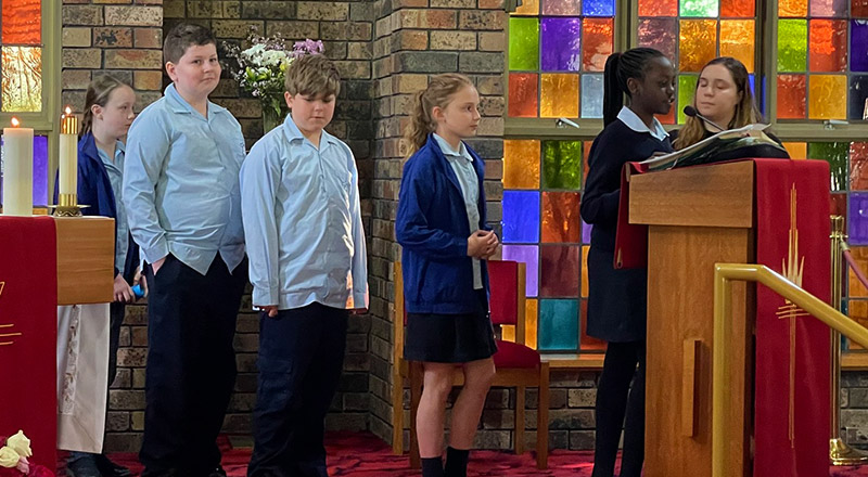 St Bernadette's Catholic Primary School Lalor Park students reading at mass