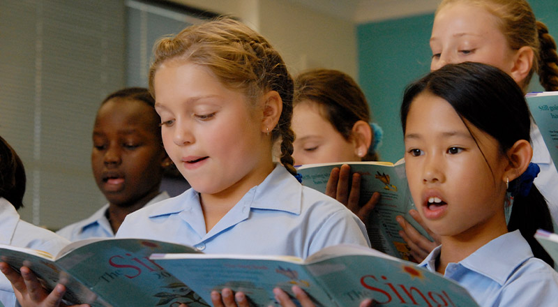 Old photo of St Bernadette's Catholic Primary School Lalor Park students singing in choir