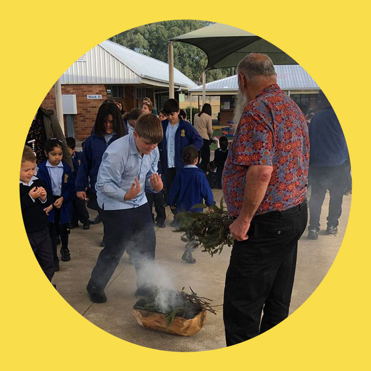 St Bernadette's Catholic Primary School Lalor Park student participating in smoke ceremony