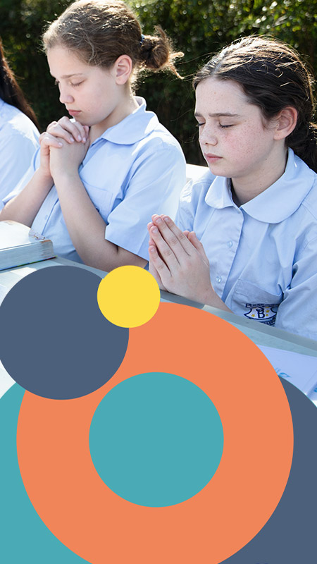 St Bernadette's Catholic Primary School Lalor Park students praying outside
