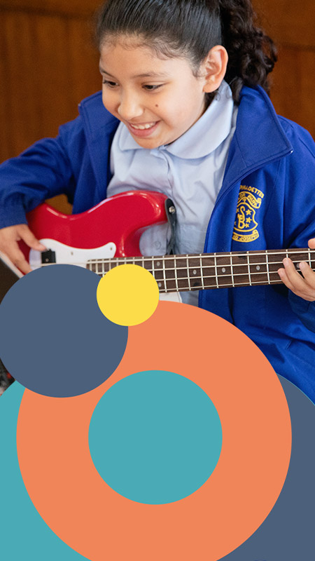 St Bernadette's Lalor Park student playing bass guitar