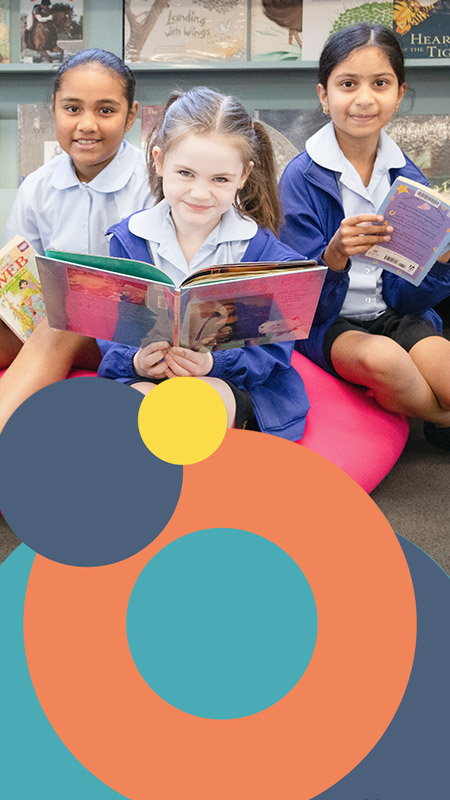 Griup of St Bernadette's Catholic Primary School Lalor Park students reading in school library