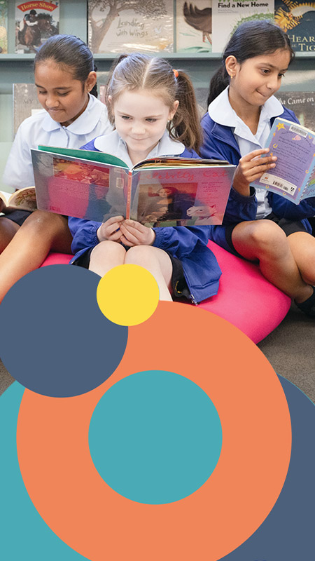 Students reading in the St Bernadette's Catholic Primary School Lalor Park school library