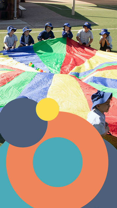 St Bernadette's Catholic Primary Lalor Park students playing with parachute