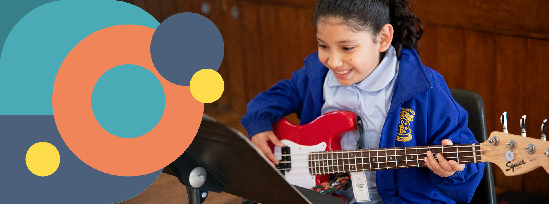 St Bernadette's Lalor Park student playing bass guitar