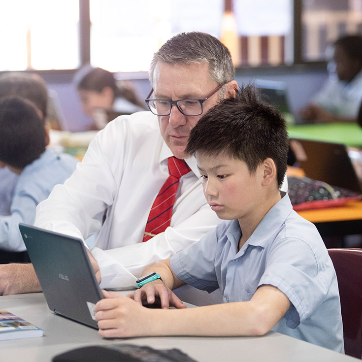 St Bernadette's Catholic Primary School Lalor Park teacher assisting student